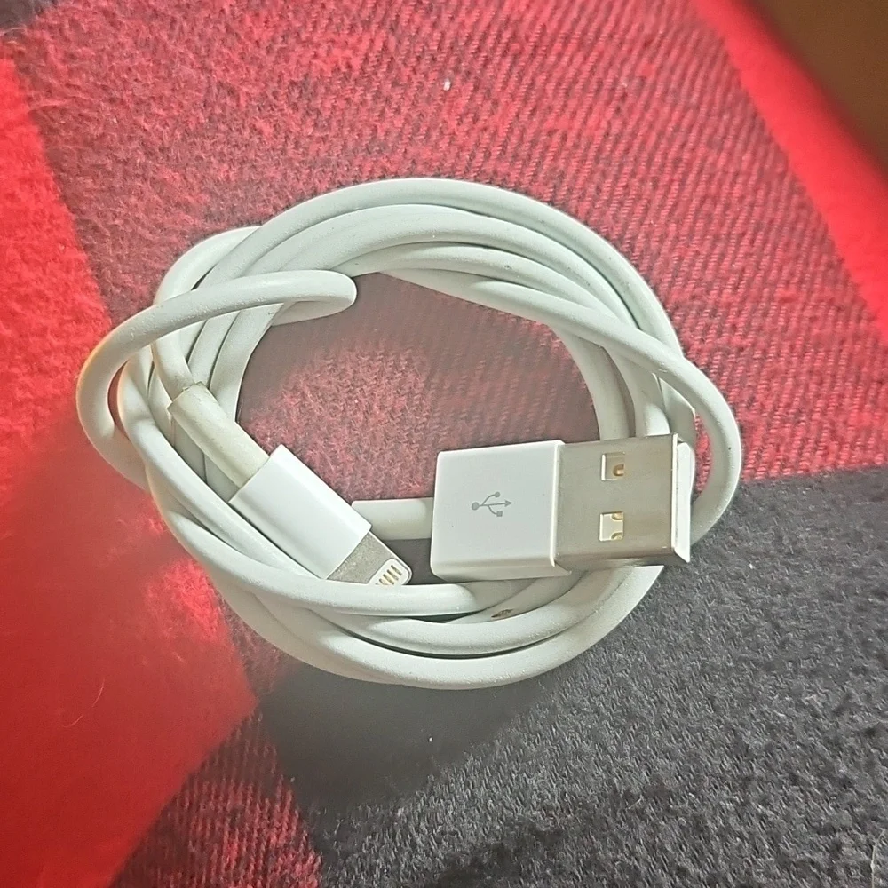 Bundle of white USB to Apple Lightning Charging Cables